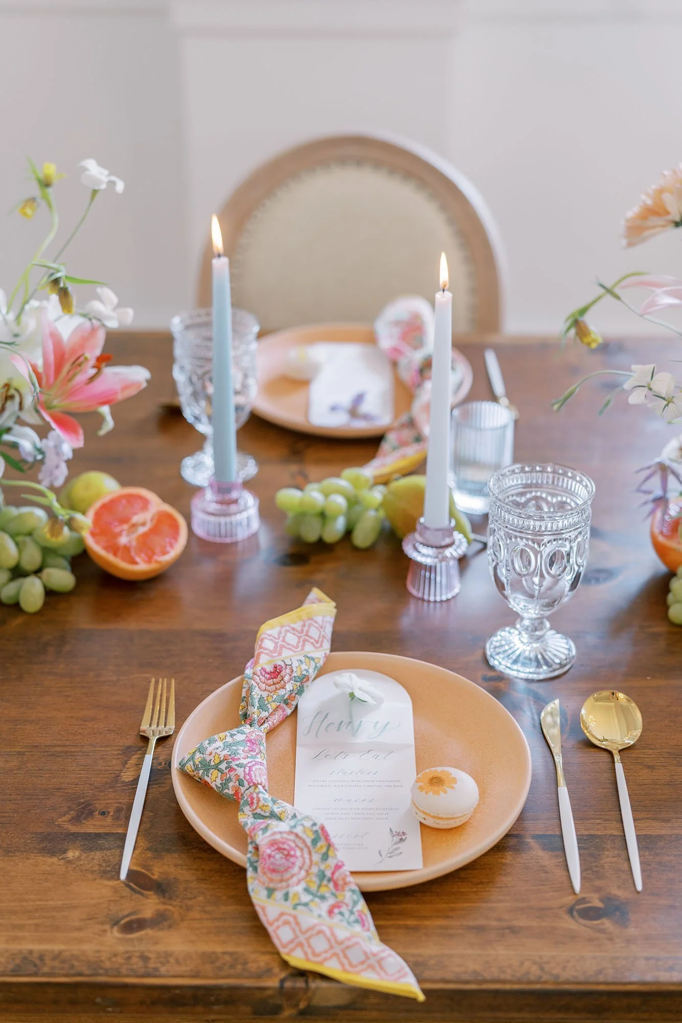 Whimsical garden wedding place setting with custom menus and floral macarons