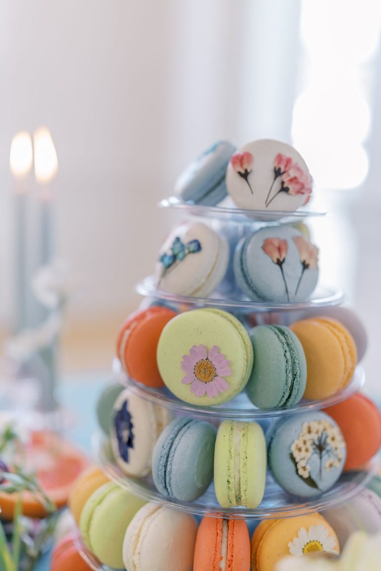 Whimsical garden wedding floral pressed macaron tower in a mix of pastel and bold colors