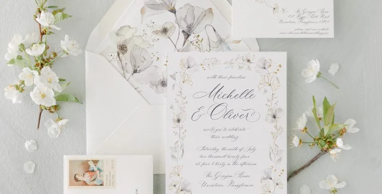 Wedding invitation suite detail with cohesive typography and layout
