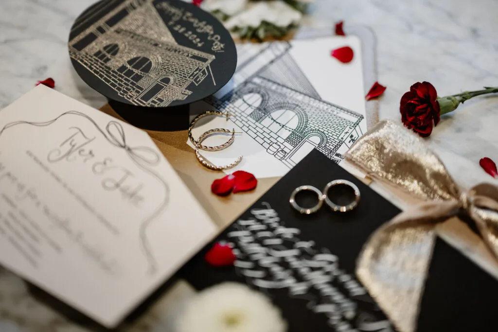 gold wedding calligraphy on black envelopes and foil stamped details on invitations