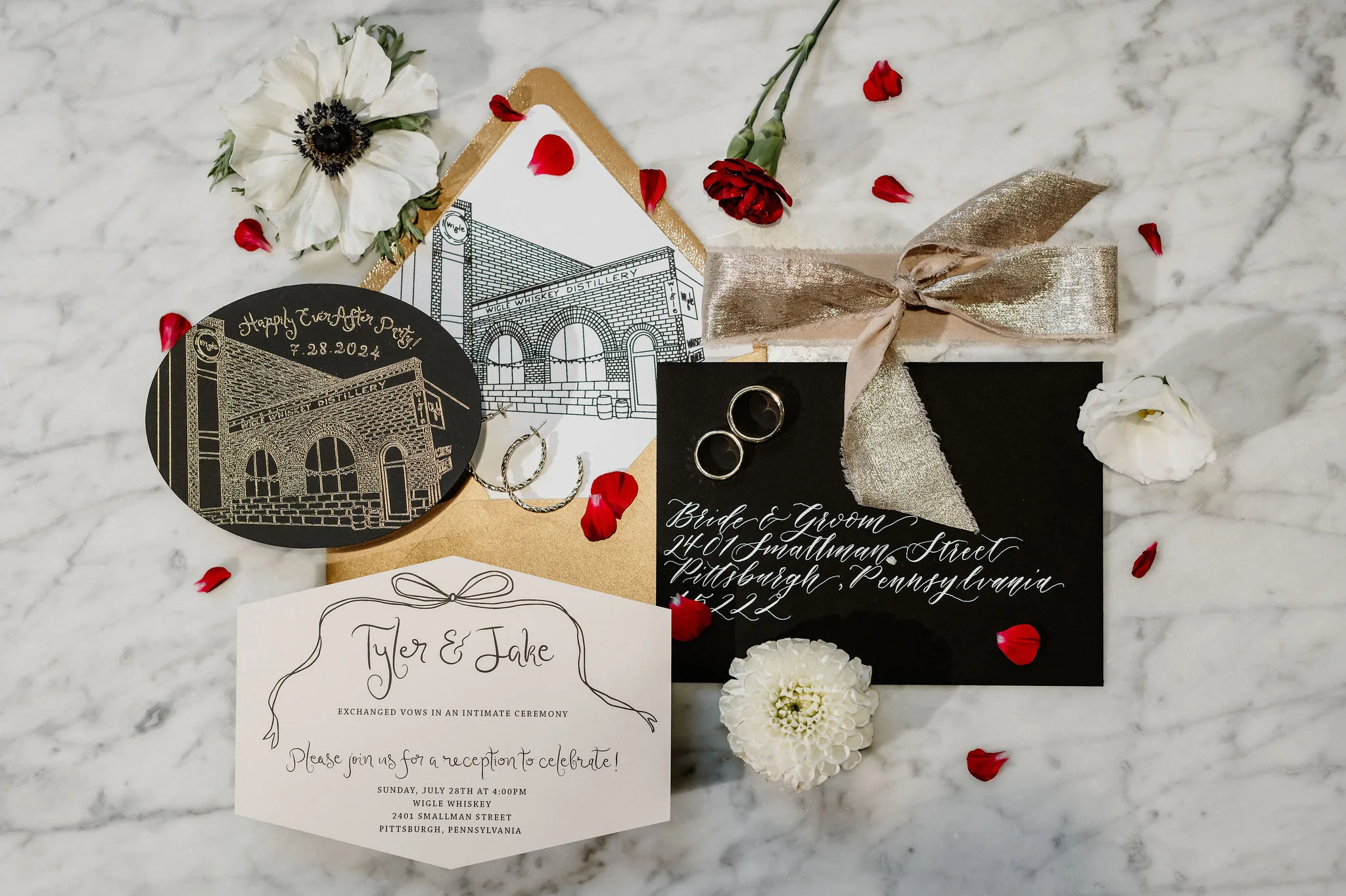 thoughtfully designed wedding invitation suite with foil details, die cut cards, custom illustration envelope liner, gold ribbon, and black envelope with gold hand done calligraphy